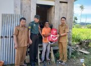 Serma Mody HM Turut Serta dalam Penyaluran Bantuan bagi Korban Banjir di Desa Motomingo