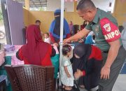Babinsa Dampingi Kegiatan Posyandu Bulanan di Desa Tolinggula Ulu