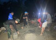 Semangat Gotong Royong: Satgas TMMD dan Warga Ombulodata Tetap Bekerja hingga Malam Hari